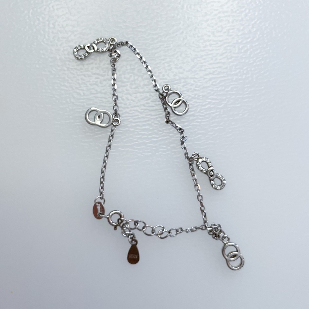 Sterling Silver Charm Bracelet with Infinity and Interlocking Rings